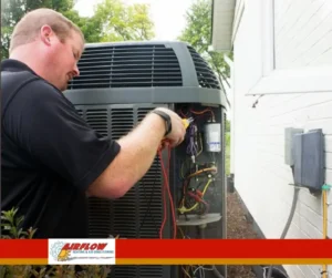 Technician installing a residential central air conditioning system